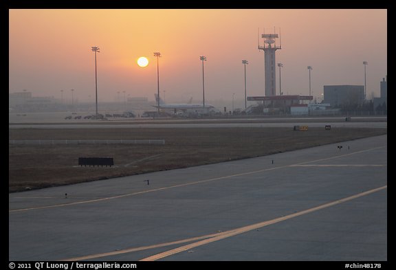 Tarmac and control tower at sunset, Beijing Capital International Airport. Beijing, China (color)