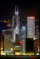 Bank of China (369m) and Cheung Kong Center (290m) buildings  across  harbor by night. Hong-Kong, China ( color)
