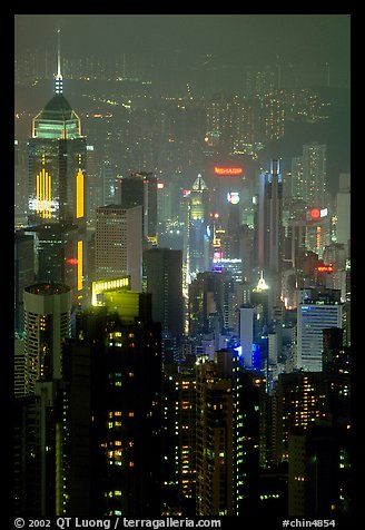 Center building with changing lights from Victoria Peak at night. Hong-Kong, China (color)