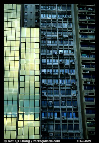 Modern building next to old  building with air conditioners, Hong-Kong Island. Hong-Kong, China