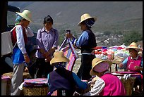 Bai women wearing tribespeople dress at the Monday market. Shaping, Yunnan, China (color)