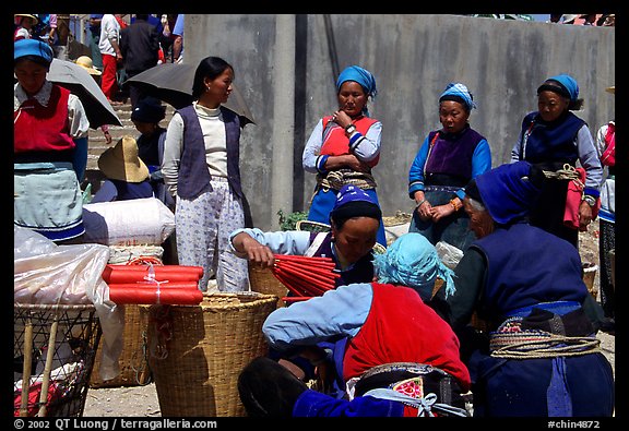 Women of the Bai tribe selling incense. Shaping, Yunnan, China (color)