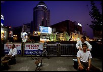 Public massage on the traffic square at  the intersection of Zhengyi Lu and Dongfeng Lu. Kunming, Yunnan, China (color)