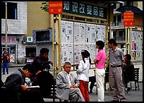 Reading dazibao (public newspapers). Kunming, Yunnan, China ( color)