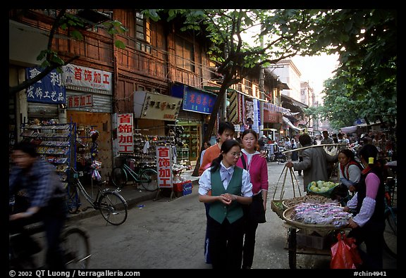 Street vendors in an old street. Kunming, Yunnan, China (color)