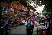 Street vendors in an old street. Kunming, Yunnan, China ( color)