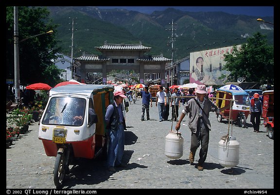 Street activity in front of the West gate. Dali, Yunnan, China (color)