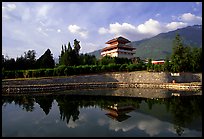 Chong-sheng Si, temple behind the Three Pagodas, reflected in a pond. Dali, Yunnan, China (color)