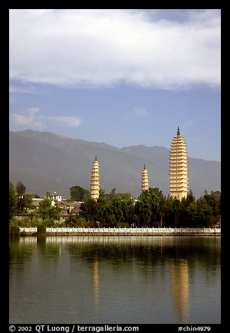 San Ta Si (Three pagodas) reflected in a lake, early morning. Dali, Yunnan, China