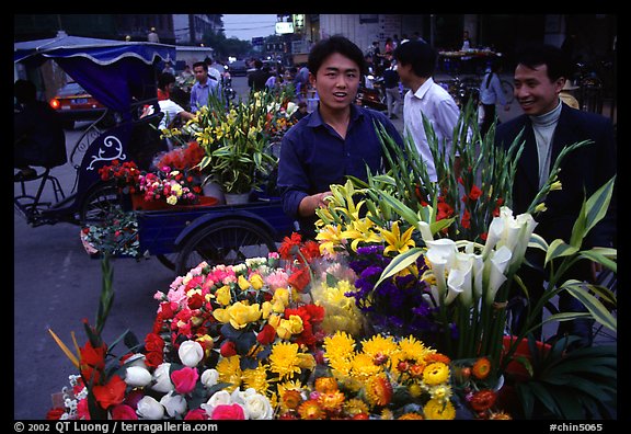 Flower vendor, night market. Leshan, Sichuan, China (color)