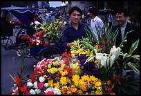 Flower vendor, night market. Leshan, Sichuan, China ( color)