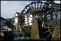 Big water wheel at the entrance of the Old Town. Lijiang, Yunnan, China
