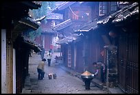 Street in the morning with dumplings being cooked. Lijiang, Yunnan, China ( color)