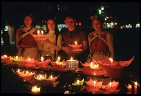 Candlelight lanters to be floated on a canal at night. Lijiang, Yunnan, China (color)