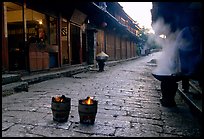 Dumplings being cooked in a cobblestone street. Lijiang, Yunnan, China (color)