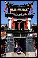 Woman under the Kegong tower archway. Lijiang, Yunnan, China ( color)
