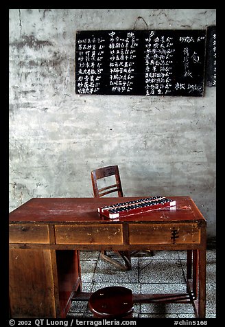 Desk counting frame and Chinese script on blackboard. Emei Shan, Sichuan, China (color)
