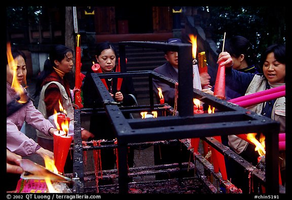 Pilgrims burning big incense batons. Emei Shan, Sichuan, China (color)