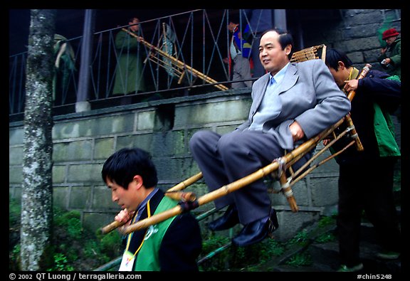 Wealthy pilgrim carried down Jieyin Palace on a chair. Emei Shan, Sichuan, China (color)