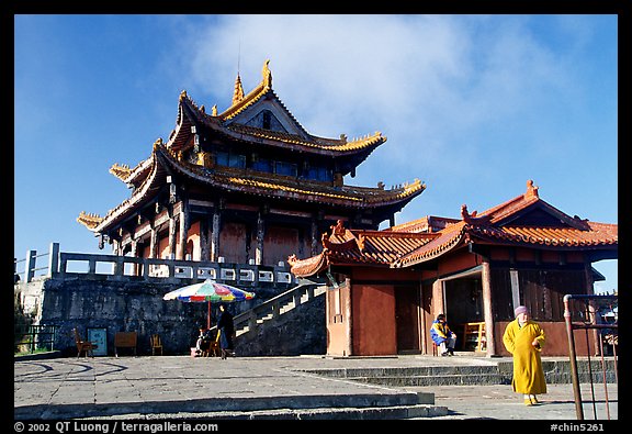 Monk walking in front of Jinding Si temple. Emei Shan, Sichuan, China (color)