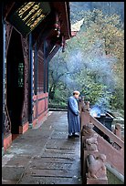 Monk in front of Jieyin Palace. Emei Shan, Sichuan, China (color)