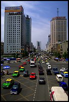 Car traffic on a major avenue. Chengdu, Sichuan, China (color)
