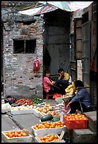 Fruit vendors in a narrow alley. Guangzhou, Guangdong, China ( color)