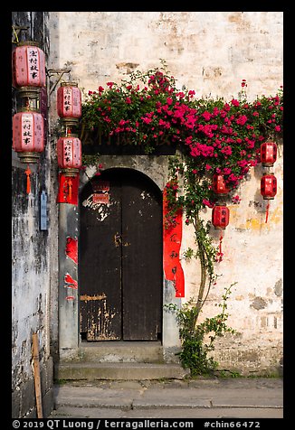 Wooden door with lanterns and flowers. Hongcun Village, Anhui, China