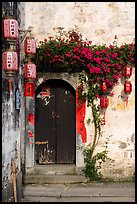 Wooden door with lanterns and flowers. Hongcun Village, Anhui, China ( color)