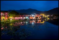 Hongcun village reflected in South Lake at night. Hongcun Village, Anhui, China ( color)