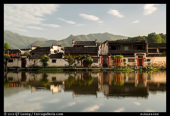 Village reflected in Nanhu Lake, morning. Hongcun Village, Anhui, China