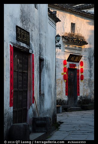 Morning light streaming on walls with lanterns. Xidi Village, Anhui, China