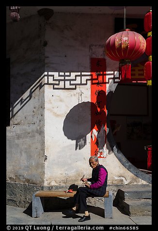 Elderly woman eating. Xidi Village, Anhui, China (color)