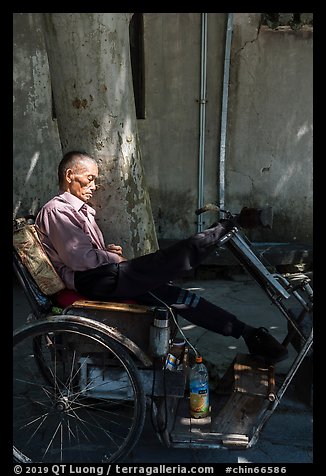 Man sleeping on cyclo. Xidi Village, Anhui, China