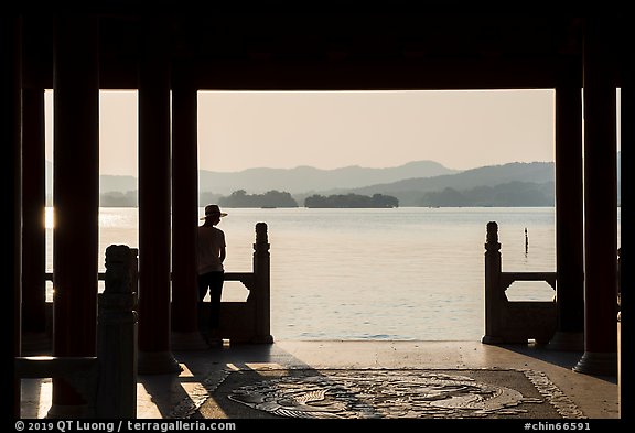Man in Cuiguang Pavilion and West Lake. Hangzhou, China (color)