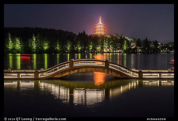 Long Bridge and Leifeng Pagoda at night, West Lake. Hangzhou, China