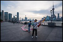 Men preparing to fly kites. Shanghai, China ( color)