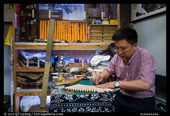 Man working on fan. Shanghai, China (color)