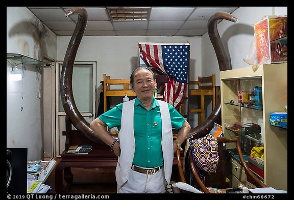 Ivory merchant with mammoth tusk. Shanghai, China