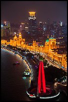 Peoples Memorial and illuminated Bund buildings at night from above. Shanghai, China ( color)