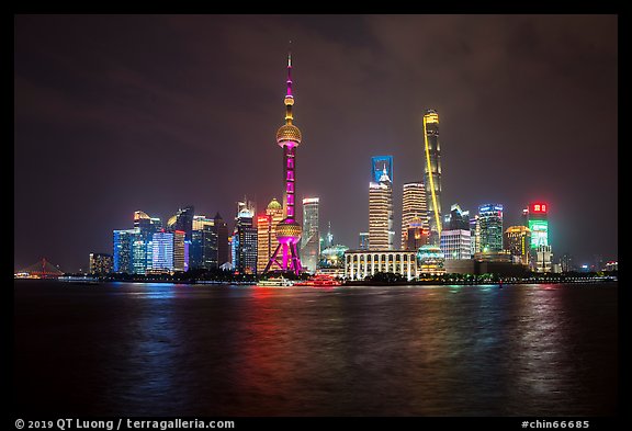City skyline above Huangpu River at night. Shanghai, China (color)