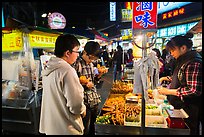 Customer buying foods at Shilin Night Market. Taipei, Taiwan ( color)