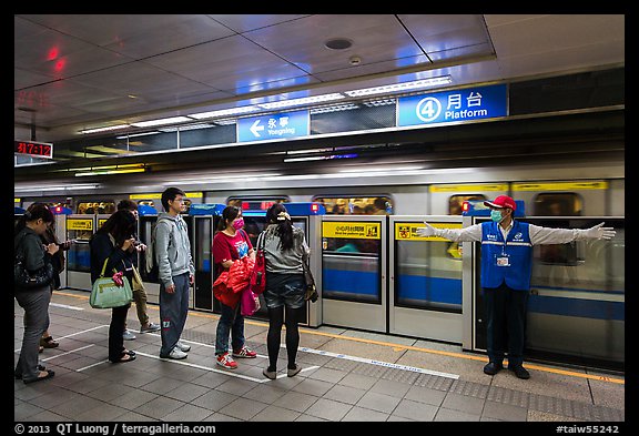 Subway with staff directing passengers. Taipei, Taiwan