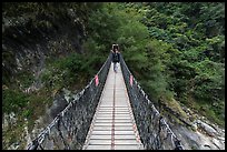 Hiker on suspension footbridge, Taroko Gorge. Taroko National Park, Taiwan ( color)
