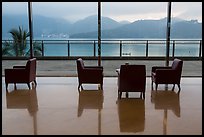 Chairs in hotel lobby with view of lake. Sun Moon Lake, Taiwan (color)