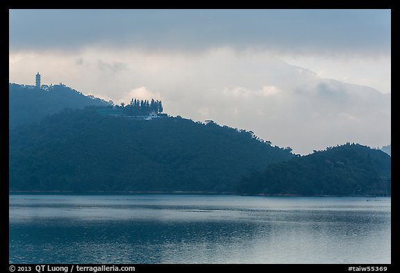 Shabalan Mountain ridge in mist with Syuanzang Temple and Tsen Pagoda. Sun Moon Lake, Taiwan