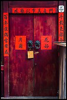 Wooden door traditional lock and chinese inscription on red paper. Lukang, Taiwan ( color)