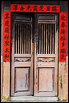 Wooden door with chinese script on red paper. Lukang, Taiwan ( color)