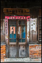 Door with weathered wood and inscriptions. Lukang, Taiwan ( color)