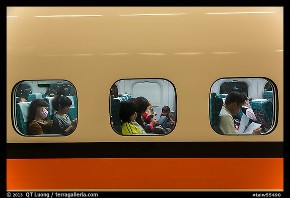 High speed rail car passengers seen through windows. Taiwan